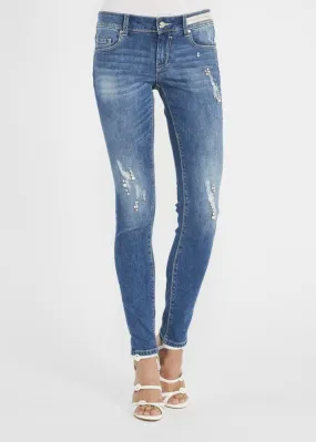 Jeans skinny con dettagli gioiello